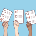 three cartoon hands holding poll or voting cards in the air giving the impression they are voting in an election